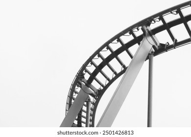 An abstract photo of a roller coaster track with a black and white background. Amusement in the Taman Safari, Puncak, Bogor, Indonesia - Powered by Shutterstock