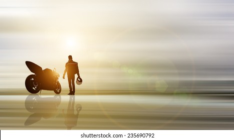 Abstract Piece Of Art. Biker And Motorcycle With Background In Motion Blur