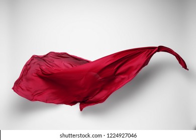 abstract piece of red fabric flying, high-speed studio shot - Shutterstock ID 1224927046