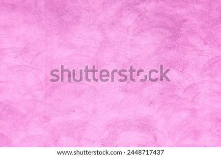 Abstract pink color toned painted congrete wall texture as background.