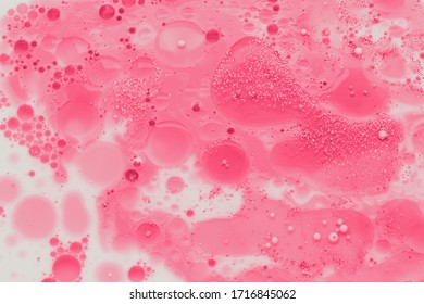 Abstract pink liquid bubbles background. - Shutterstock ID 1716845062