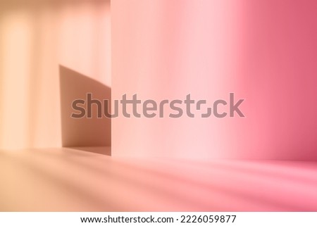 Abstract pink studio background for product presentation. Empty gray room with shadows of window. Display product with blurred backdrop.