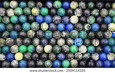 Abstract planetoid pattern using marbles of unique colors and patterns