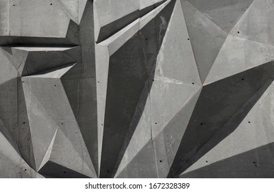 Abstract polygonal triangle sharp angles gray tones shades cast reinforced concrete rough texture background