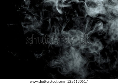 Abstract powder or smoke isolated on black background
