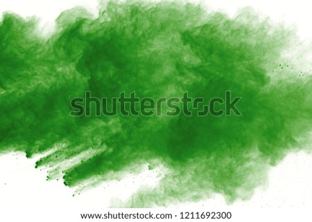 abstract powder splatted background,Freeze motion of green powder exploding/throwing green dust