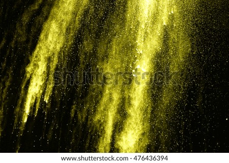 abstract powder splatted background,Freeze motion of white powder exploding/throwing yellow powder