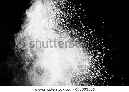 abstract powder splatted background,Freeze motion of color powder 
exploding/throwing color powder,color glitter texture on black background



