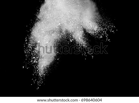 Abstract powder splatted background,Freeze motion of color powder exploding/throwing color powder, color glitter texture on black background