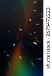Abstract prism light effect with rainbow spectrum and colorful lens flares on dark background. Optical dispersion creating vibrant chromatic aberration.