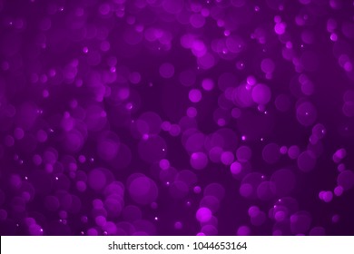 Abstract purple bokeh background. Defocused background. Blurred bright light. Circular points.
