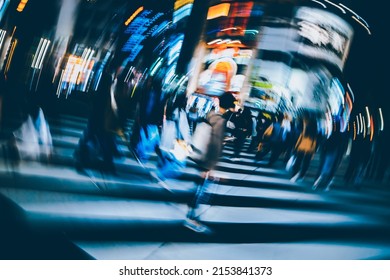 Abstract Radial Blur Of Pedestrian Crossing Or Crosswalk In Shinjuku City During Evening Rush Hour With Many People Waiting To Cross. Urban Nightlife And Commuter Rushing Concept In Tokyo, Japan.