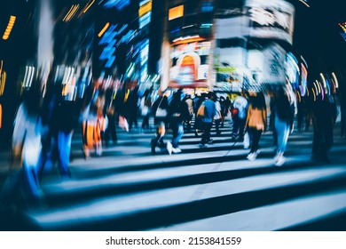 Abstract Radial Blur Of Pedestrian Crossing Or Crosswalk In Shinjuku City During Evening Rush Hour With Many People Waiting To Cross. Urban Nightlife And Commuter Rushing Concept In Tokyo, Japan.