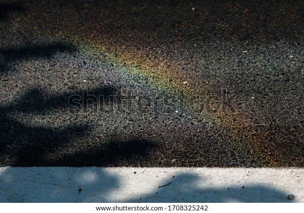 Abstract rainbow going on\
asphalt road