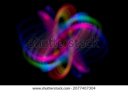 Abstract rainbow path of moving LED light on black backgroung