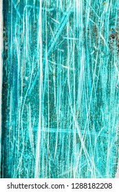 Abstract and random texture patterns where surface paint is scratched off revealing older paint. Linear damage, stripes and blisters caused by dragging to create chaotic grunge backgrounds.