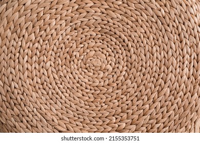 Abstract rattan texture. Background with round large straw fabric. textured water hyacinth background.