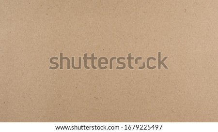 Abstract recycled paper brown texture background.
Old Kraft paper box craft pattern.
top view.