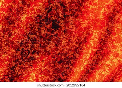 Abstract Red Background. Molten Resin Flows Down The Hot Stone Surface. The Pattern And Texture Of The Molten Material.