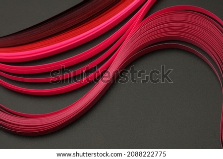 Abstract  red color wave paper on texture black background.