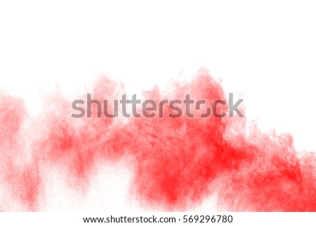 Abstract red dust explosion on white background.Abstract red  powder splatted on white background,Freeze motion of red powder exploding/throwing red powder.