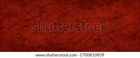 Abstract red grunge background. Dark red old rough cracked asphalt texture. Valentine, anniversary, event, Christmas, New Year, celebration concept. Web banner. Wide. Panoramic. 