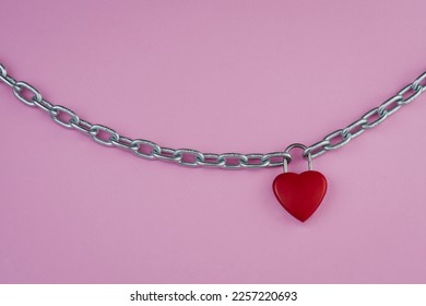 Abstract, red heart shaped combination lock, Symbol valentine, happy, unhappy, metal chain padlock. Material for creative idea love concept. Isolated on pink background, clipping path. Blank for text - Shutterstock ID 2257220693