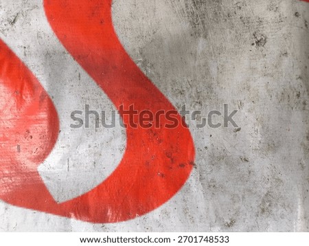 Abstract Red Mark on Worn Painted Surface Showing Rough Texture and Distressed Pattern With Strong Curved Shape Contrast on Aged Material for Creative Visual Design Element