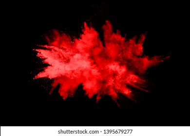 Abstract Red Powder Explosion On Black Background.abstract Red Powder Splatted On Black Background. Freeze Motion Of Red Powder Exploding.