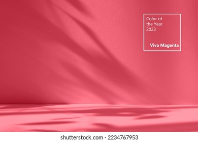 Abstract red studio background for product presentation. Empty room with shadows of window and flowers and palm leaves . 3d room with copy space. Trendy Color of the Year 2023 viva magenta