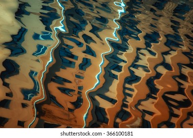 Abstract reflection in water of building