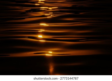 Abstract reflections on the water's surface, vibrant colors.