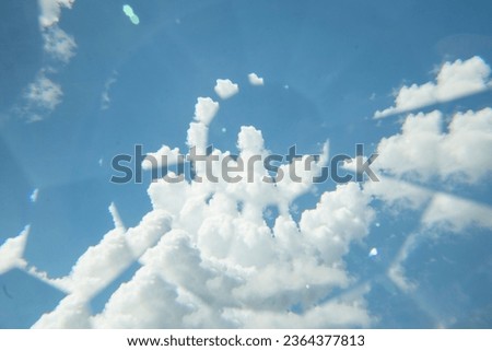 Abstract Refraction of a Bright Blue Sky with Fully White Clouds