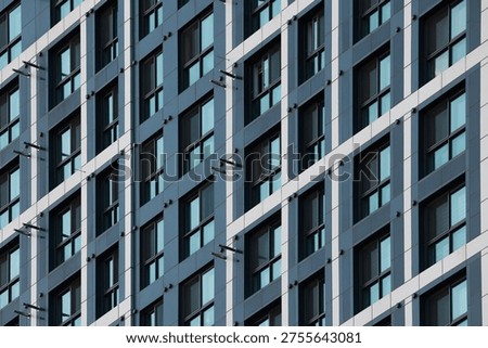 Abstract repetitive window pattern of a modern residential apartment building facade in South Korea