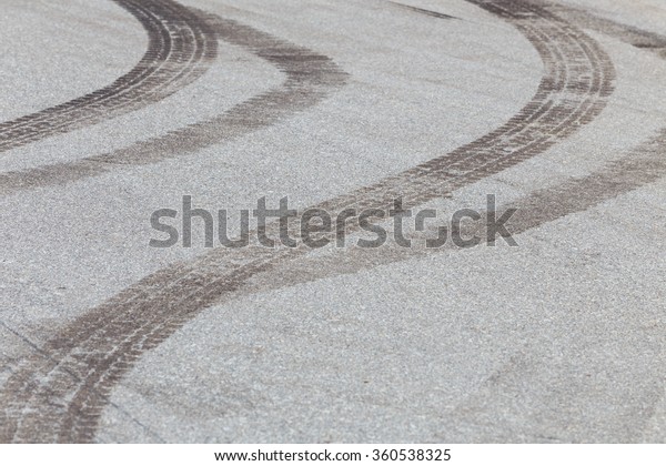 abstract road background with crossing of road\
marking and tires\
track