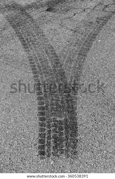 abstract road background with crossing of road\
marking and tires\
track