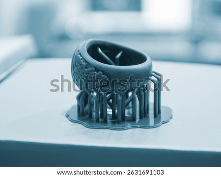 Abstract round art object printed on 3D printer from photopolymer. Model printed on 3D printer from liquid photopolymer resins. SLA 3D printing technology. Printing technology.