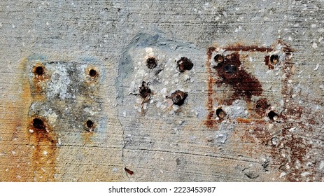 Abstract Rusted Bolts In Concrete Dock