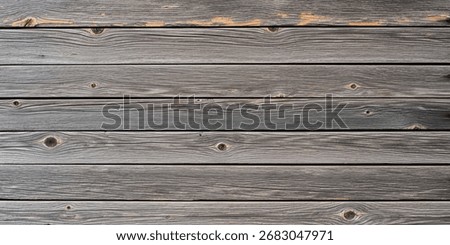 Abstract rustic background of weathered barn wood, muted gray and brown tones with rough grain, creating a timeless natural minimal wallpaper.