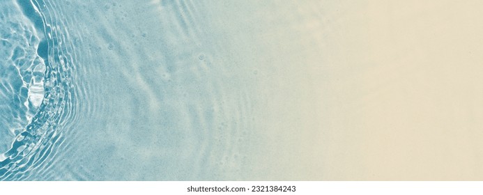 abstract sand beach from above with light blue transparent water wave and sun lights, summer vacation background concept banner with copy space, natural beauty spa outdoors