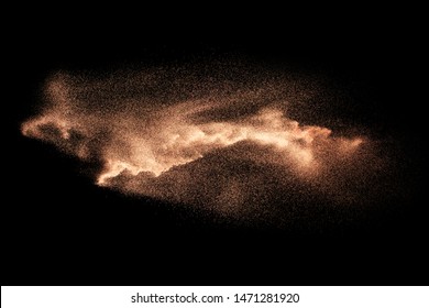 Abstract Sand Cloud.Brown Sand Splash Against Dark Background. Brown Dust Explosion.