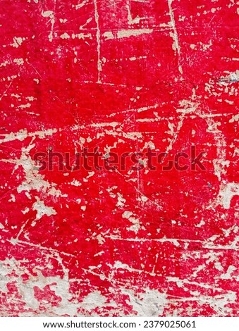Abstract scratched red painted background. Dirty weathered cement wall with scratched paint. Abstract red paint grunge background. Abstract red painted old wall banner.