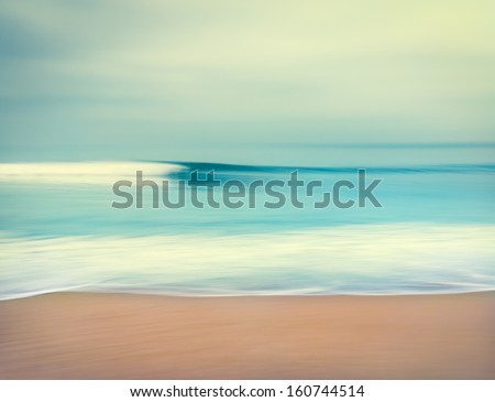 An abstract seascape with blurred panning motion.  Image displays a retro, vintage look with cross-processed colors.