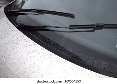 An abstract section of the front end of a silver vehicle and its front windscreen bonnet and wipers - Shutterstock ID 160554653