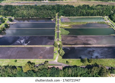 Abstract sendimentation tank of ironworks water treatment plant in Dabrowa Gornicza Silesia Poland aerial drone photo view