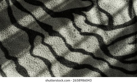 Abstract shadow patterns on textured surface.