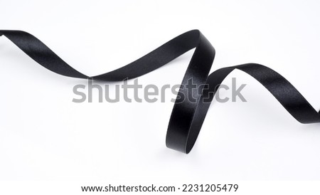 Abstract shape black ribbon isolated on white background.