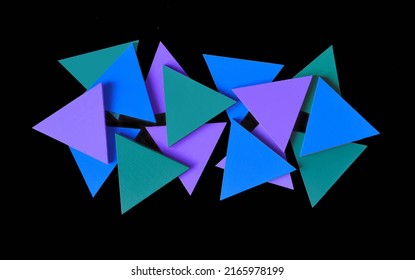 Abstract Shaped Blue Triangle Solid Pieces On Black Background.