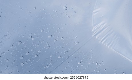 Abstract shapes, patterns and textures of plastic water droplets on a blue sky background. Copy space for graphic design. Natural pattern and texture background. Transparent plastic roof - Powered by Shutterstock