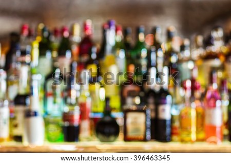 Abstract shelves with different bottles of alcohol